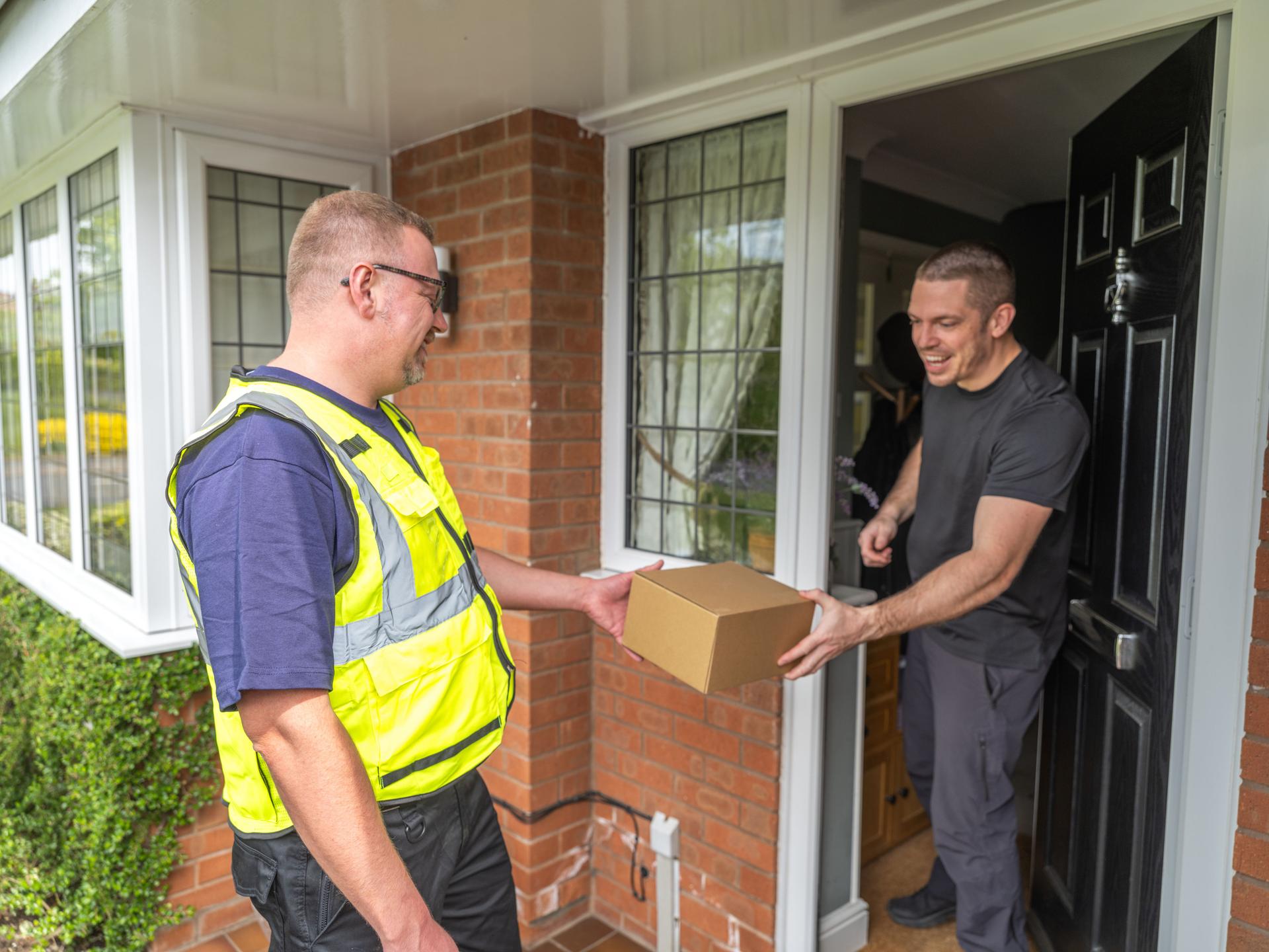 Courier Handing Package to Resident